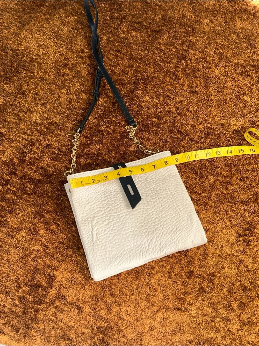 Cream Crossbody Bag with Black Strap and Gold Chain Accent